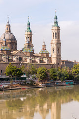 Fototapeta premium The Cathedral-Basilica of Our Lady of Pillar - a roman catholic church, Zaragoza, Spain. Copy space for text. Vertical.