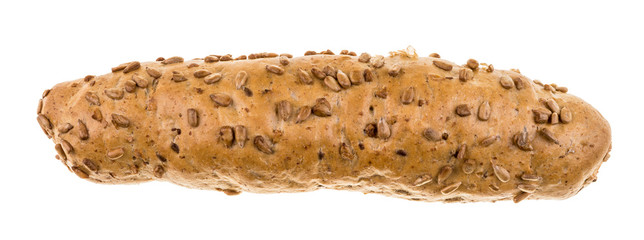 Wholegrain bread roll sprinkled with sunflower seeds. Baked crunchy loaf of brown bread isolated on white background.