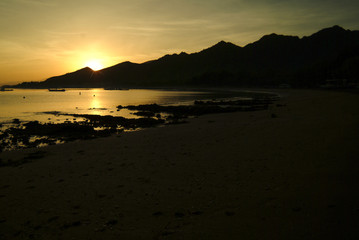 Fototapeta premium Sunrise On Pemuteran Beach, Bali, Indonesia. In the northwest corner of Bali the village of Pemuteran is the gateway to Bali Barat national park. A diving and tourism destination. 