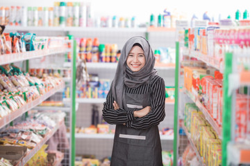 muslim woman working at supermarket