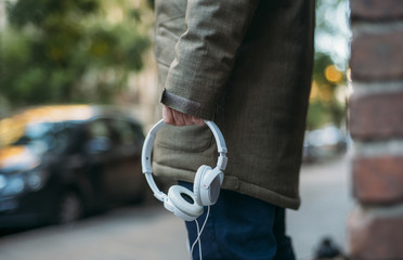 Man listens to music with headphones and smart phone.