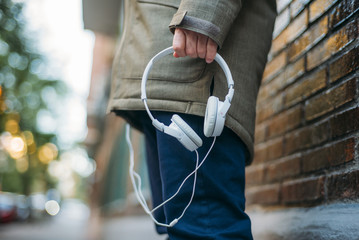 Man listens to music with headphones and smart phone.