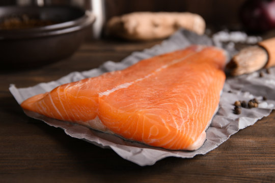 Fresh salmon fillet on table