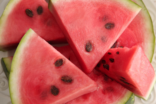 Plate with tasty sliced watermelon, closeup