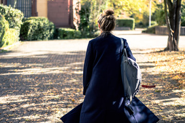 young woman walking in autumn
