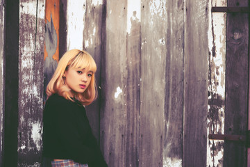 Portrait of hipster girl  on the railway vintage style,thai woman posing for take a photo,asian woman