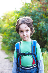 A boy with a backpack.