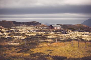 Small wooden cottage in Iceland landscape