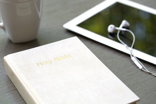 Christian background of a Bible and ipad.