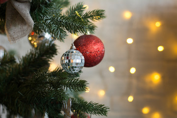 Close-up of the balls on a Christmas tree. Background of burning garlands
