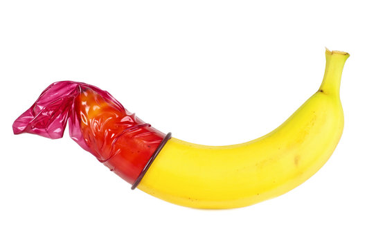 Banana with colored condom isolated on white background