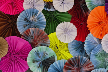 Colorful handmade paper umbrella are decorated as background or backdrop.