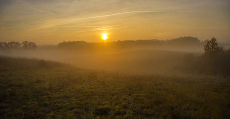 Fototapeta na wymiar misty autumn morning over the valley