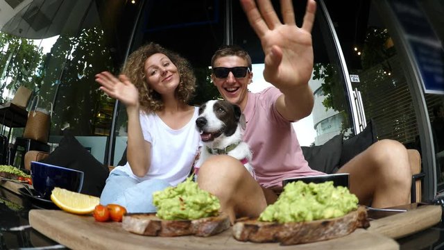Happy Family Couple Taking Selfie With Dog In Cafe. 4K. 