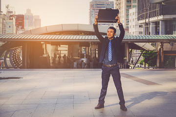 businessman holding a briefcase, powerful businessman