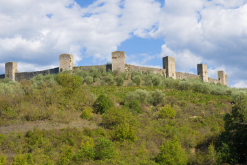 Fototapeta na wymiar Towers of medieval fortress of Monteridzhioni in the September afternoon. Tuscany, Italy