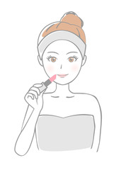 口紅を塗る女性