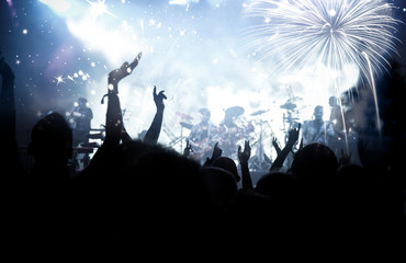 new Year concept - cheering crowd and fireworks