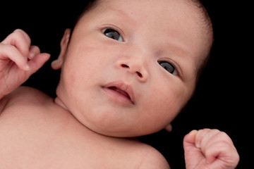 baby on black background