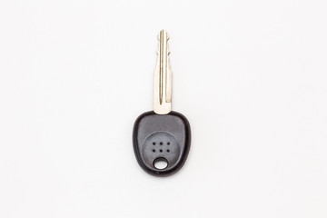 The key to the lock on a white background. The key to the door, car key.