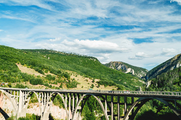 Fototapeta premium Durdevica Tara Arch Bridge over the Tara River in northern Montenegro. Zabljak, Durmitor National Park