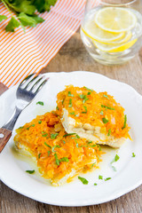 White fish fillet baked with carrots, onions, tasty dish of Russian cuisine, dinner for children