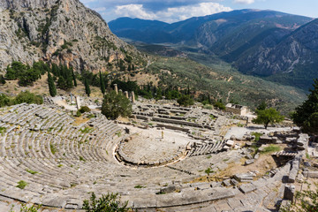 View of Ancient theater in Delphi Greece and temple of Apollo
