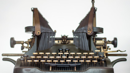 Old typewriter antique machine close up photography on a white background