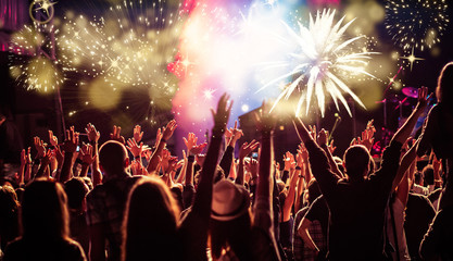 Fototapeta na wymiar cheering crowd watching fireworks - new year concept