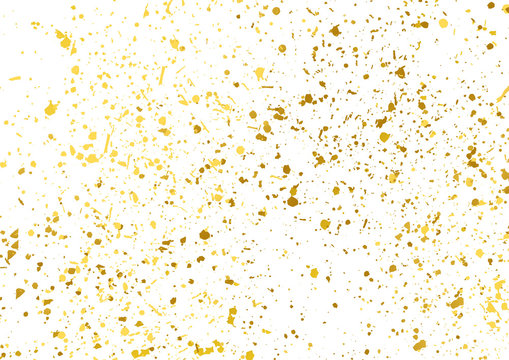 Golden foil particles over white background