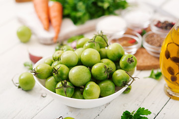 Ingredients for Korean salad from green tomatoes and carrots.