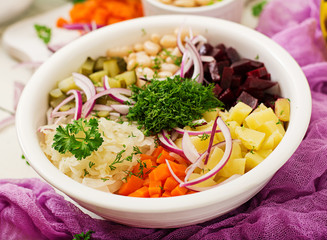 Beet salad Vinaigrette in a white bowl.