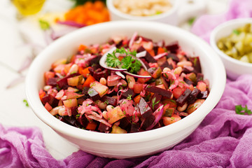 Beet salad Vinaigrette in a white bowl.