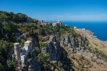 Fototapeta na wymiar Panoramic view to Tyrrhenian coastline with the Church of Saint John the Baptist and Torretta Pepoli - little castle in Erice, Sicily, Italy