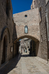 Fototapeta na wymiar Narrow ancient cobblestone street of medieval town Erice, Sicily, Italy