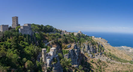 Naklejka premium Panoramic view to Tyrrhenian coastline with the Church of Saint John the Baptist, norman castle called Torri del Bali, Torretta Pepoli - little castle in Erice, Sicily, Italy