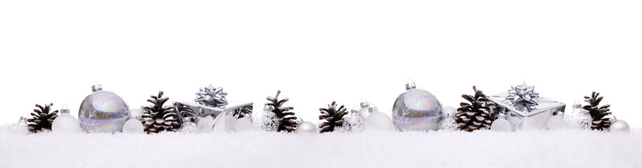 White and silver christmas balls with xmas present gift boxes in a row isolated on snow, Christmas banner