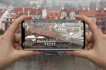 Augmented reality in marketing. Phone in hand, on screen information guide about shopping and...