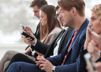 closeup of colleagues sitting at a business conference.
