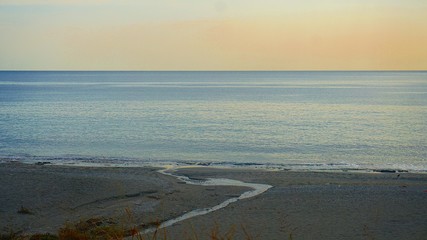 twilight on a beautiful empty beach,the end of the season.