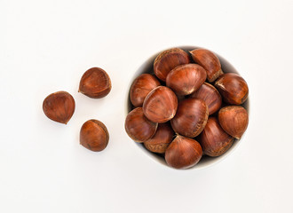 Chestnuts isolated on white background, top view
