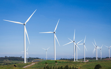 Fototapeta premium Turbines are rotating to produce electricity, photos with skies, mountains and trees are components.