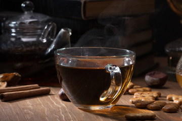 Cup with tea and teapot