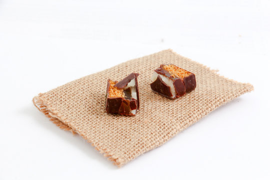 cut chocolate marzipan on small jute bag