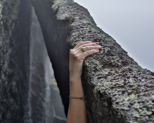 young woman rock climber hands climbing at seaside mountain cliff rock