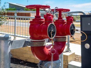 Fototapeta na wymiar Fire hydrant red with valve