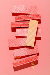 Colorful Wafers on pink paper background