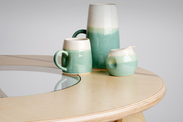 Fototapeta na wymiar Ceramic Drinking Set on a Round Table Top