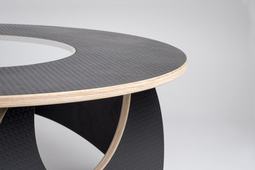 Closeup of Designer Wooden Round Table in Black Rubber Finish