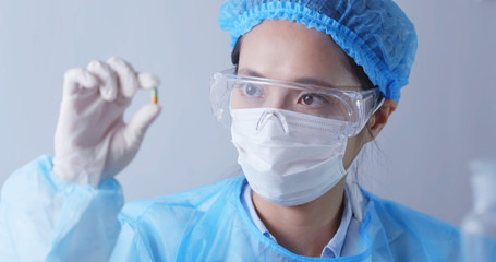 Fototapeta premium Scientist holding a medicine